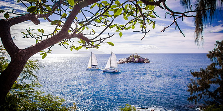 Two catamarans sailing in the Seychelles